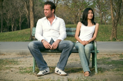 Man and woman sitting on a bench.